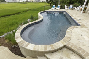 Raised Freeform pool due to water table issues