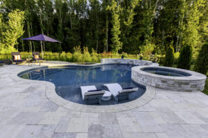 Freeform pool, wide, entry steps, year round spa, and waterfall