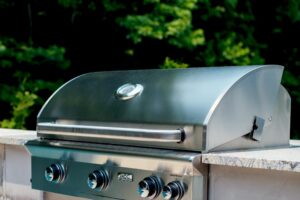 Silver BBQ built into outdoor kitchen