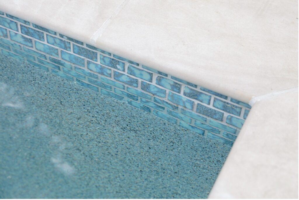 photo of pool showcasing its pool tile that was picked out at the backyard selection meeting