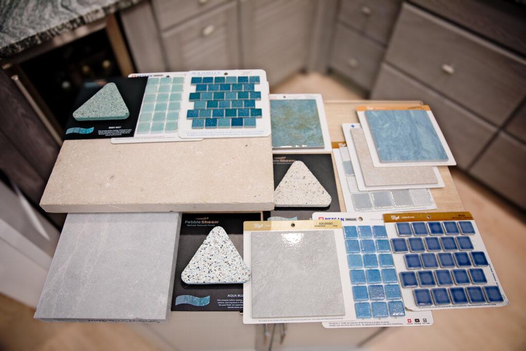 Outdoor Design material selections with hues of blue and green and natural stones