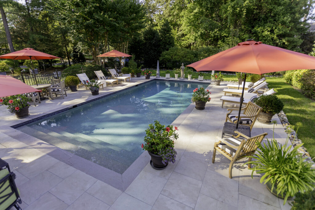 Pool Photo with porcelain pavers which are better when installing a Saltwater pool