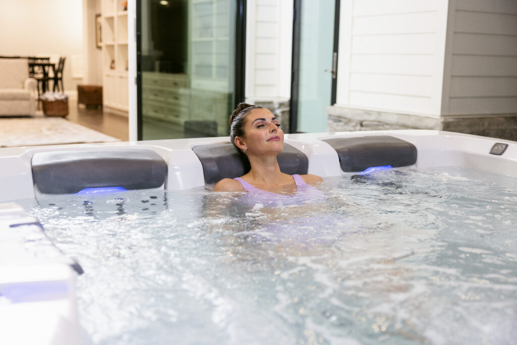 AOP System Bullfrog Spa with a woman relaxing